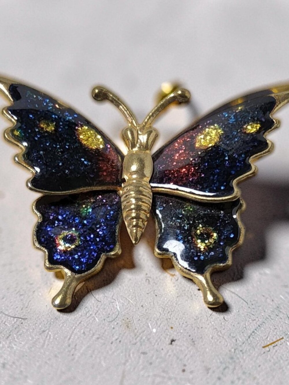 vintage gold tone butterfly brooch enameled in sparkling metallic blue and red